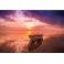 Poster bateau devant un coucher de soleil